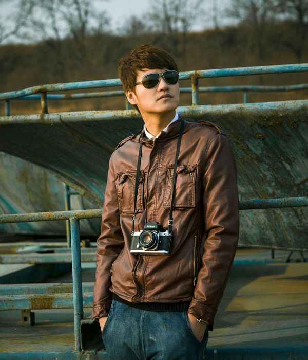 Portrait of a confident and calm man looking away from the camera.
